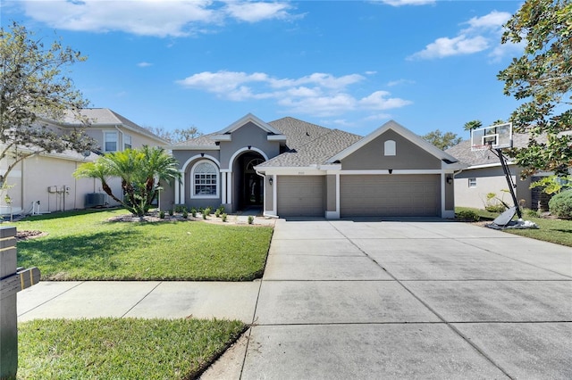 view of front of property featuring a front lawn, central air condition unit, stucco siding, a garage, and driveway