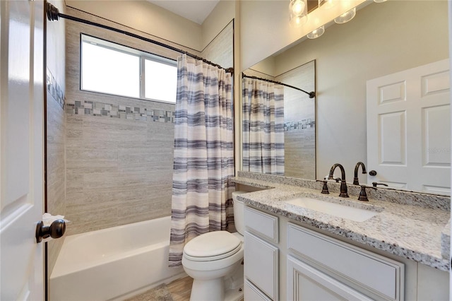 full bath featuring shower / bath combination with curtain, toilet, and vanity