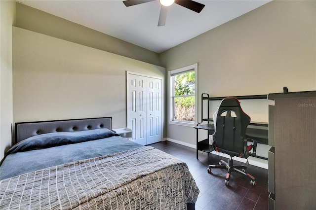 bedroom with wood finished floors, baseboards, a closet, and ceiling fan