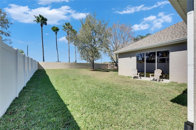 view of yard with a fenced backyard