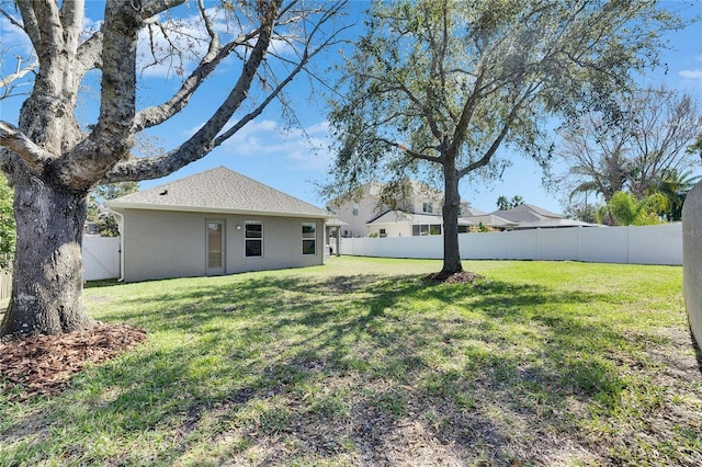 view of yard with a fenced backyard