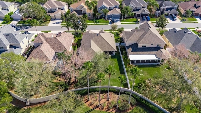 birds eye view of property with a residential view