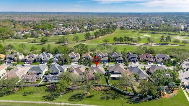 drone / aerial view with a residential view and golf course view