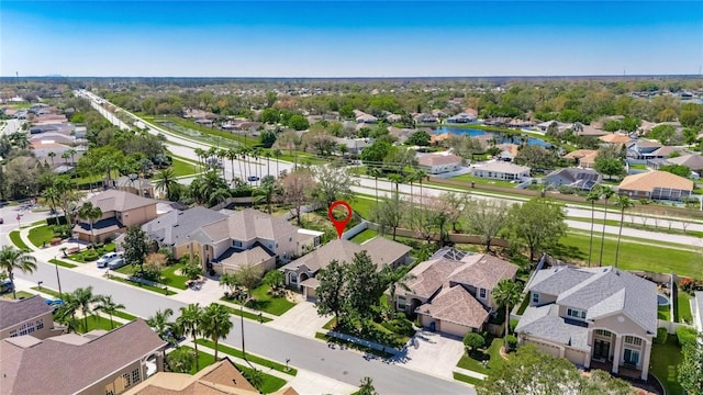 bird's eye view with a residential view and a water view