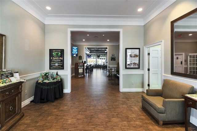 hallway featuring recessed lighting, baseboards, wood finished floors, and crown molding