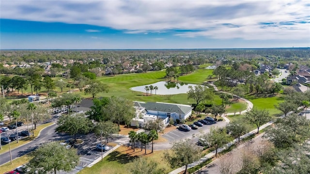 aerial view with golf course view and a water view