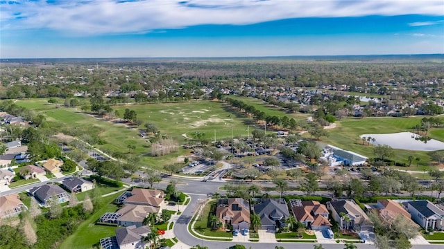 bird's eye view with a residential view, view of golf course, and a water view