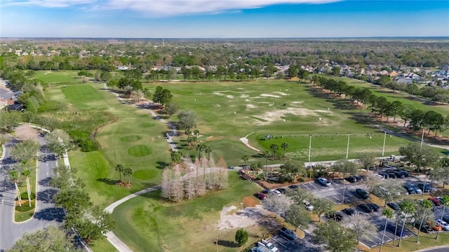 birds eye view of property with golf course view