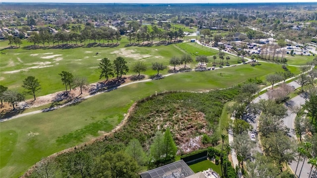 bird's eye view with view of golf course