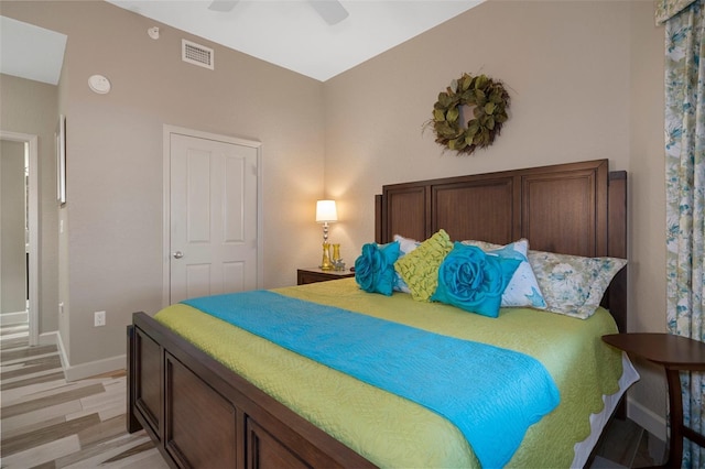 4951 Bacopa Ln S Unit 801, Saint Petersburg, FL 33715 - bedroom with a ceiling fan, baseboards, visible vents, and light wood finished floors