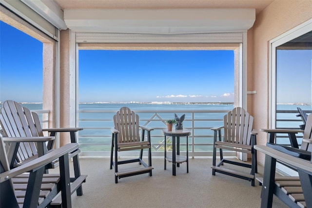 4951 Bacopa Ln S Unit 801, Saint Petersburg, FL 33715 - sunroom / solarium featuring a water view