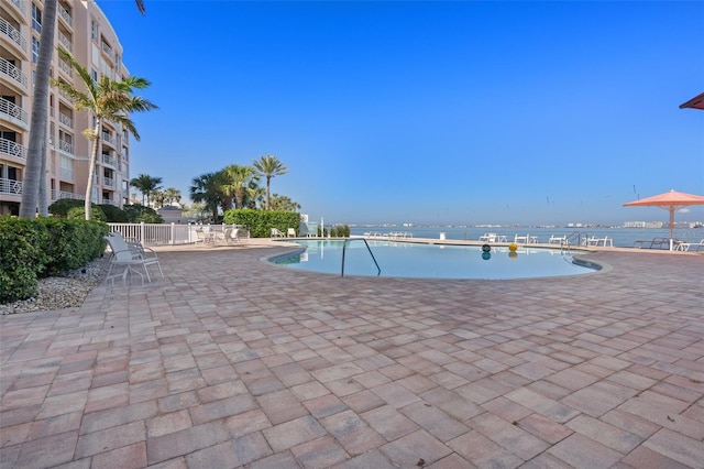 4951 Bacopa Ln S Unit 801, Saint Petersburg, FL 33715 - pool featuring a water view, a patio, and fence