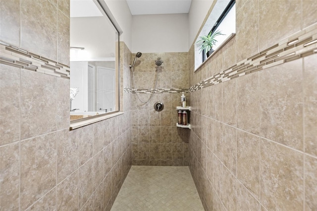 full bath with a tile shower