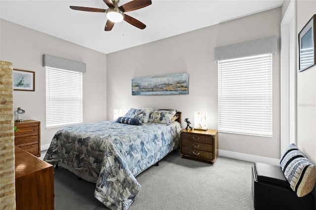 bedroom with carpet floors, a ceiling fan, and baseboards