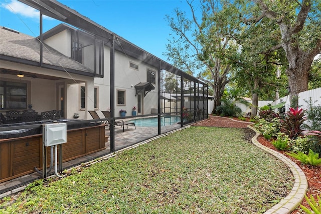 view of yard with glass enclosure, a fenced backyard, a jacuzzi, a fenced in pool, and a patio area