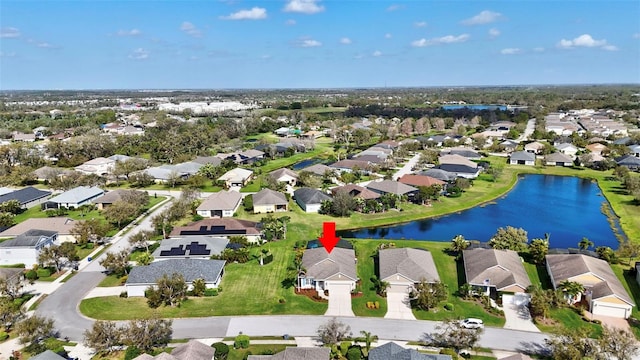 aerial view featuring a water view and a residential view