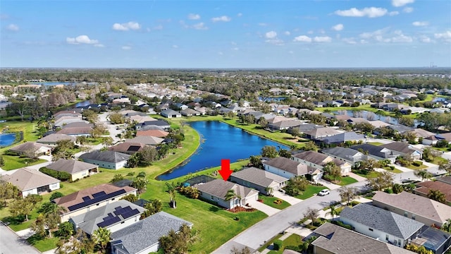 bird's eye view featuring a residential view and a water view