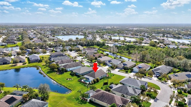 aerial view with a residential view and a water view