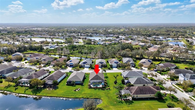 aerial view featuring a residential view and a water view