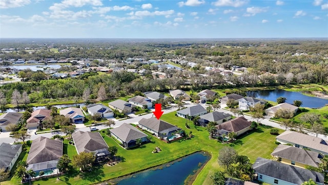 aerial view featuring a residential view and a water view