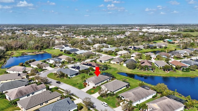 aerial view with a residential view and a water view