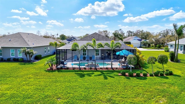 back of property featuring a lanai, a patio area, an outdoor pool, and a lawn