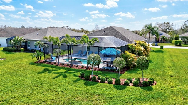 back of house with a lanai, an outdoor pool, a lawn, and a patio