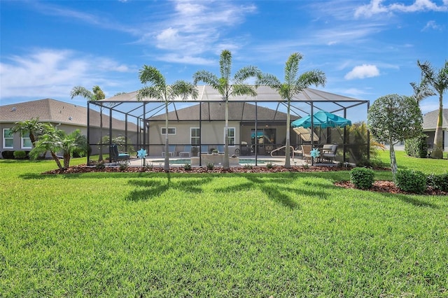 back of property with an outdoor pool, a lanai, a lawn, and a patio