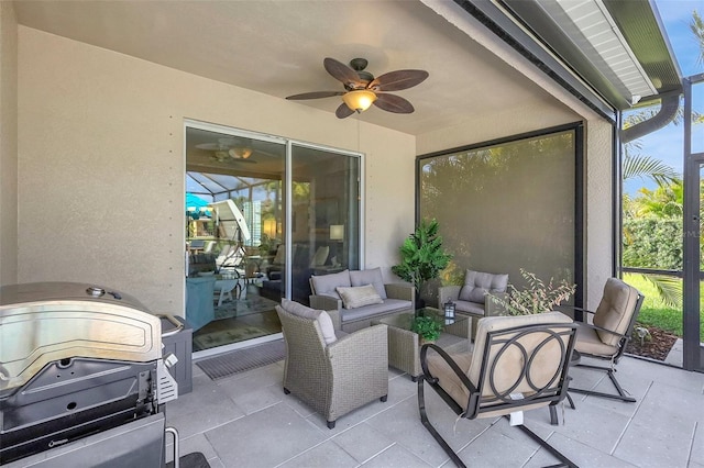 sunroom / solarium featuring ceiling fan