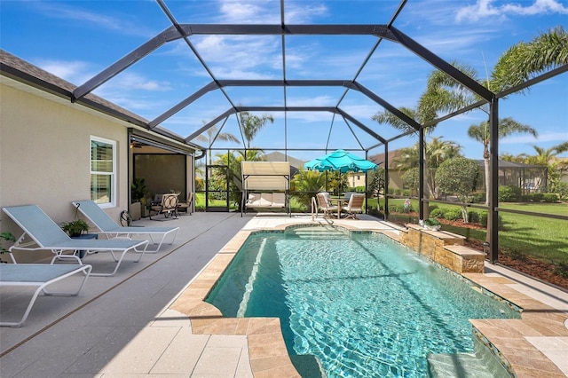 pool with a lanai and a patio area