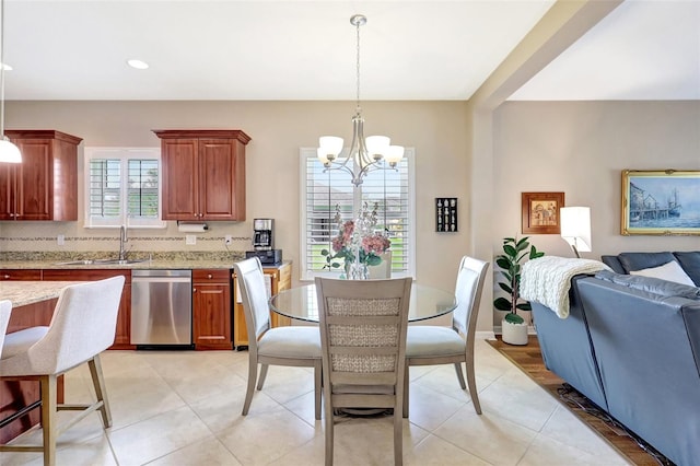 dining space with recessed lighting, light tile patterned flooring, and an inviting chandelier