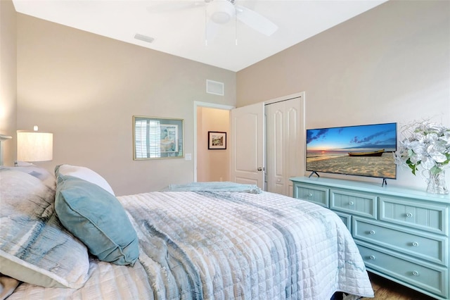 bedroom featuring a closet, visible vents, and a ceiling fan