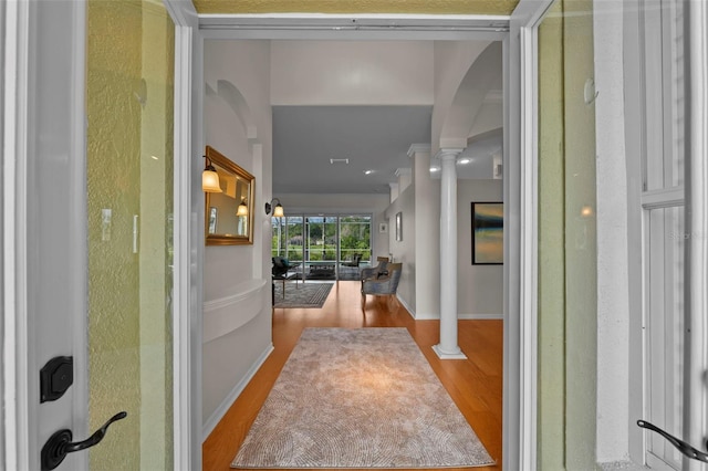 11815 Marblehead Dr, Tampa, FL 33626 - corridor with baseboards, wood finished floors, and decorative columns