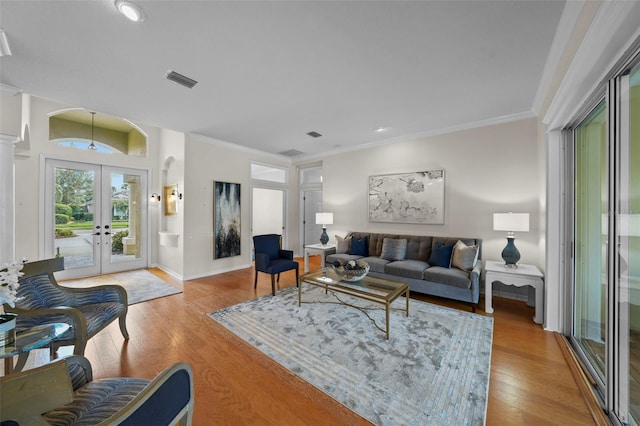 11815 Marblehead Dr, Tampa, FL 33626 - living room featuring french doors, visible vents, crown molding, and wood finished floors