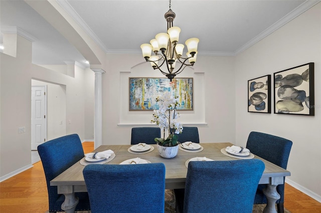 11815 Marblehead Dr, Tampa, FL 33626 - dining space featuring baseboards, wood finished floors, ornamental molding, and an inviting chandelier