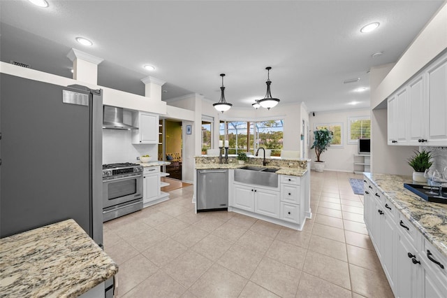 11815 Marblehead Dr, Tampa, FL 33626 - kitchen featuring a sink, wall chimney exhaust hood, tasteful backsplash, appliances with stainless steel finishes, and white cabinets