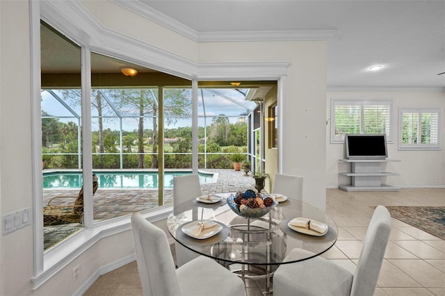 11815 Marblehead Dr, Tampa, FL 33626 - tiled dining room featuring baseboards and ornamental molding