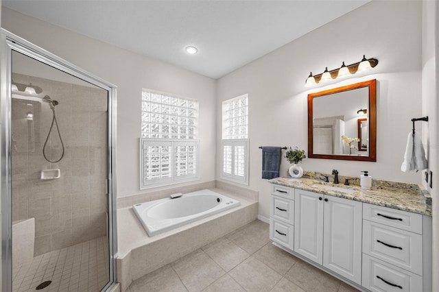 11815 Marblehead Dr, Tampa, FL 33626 - full bathroom with a stall shower, a bath, tile patterned flooring, and vanity