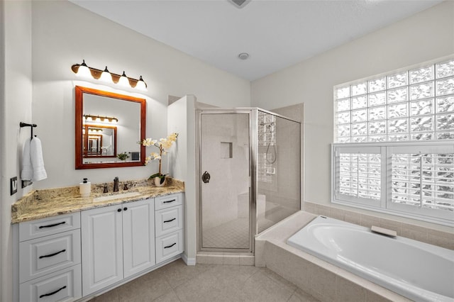 11815 Marblehead Dr, Tampa, FL 33626 - full bathroom featuring tile patterned floors, vanity, a stall shower, and a bath