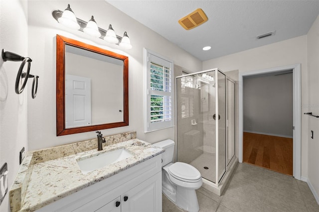 11815 Marblehead Dr, Tampa, FL 33626 - bathroom with a shower stall, visible vents, and toilet