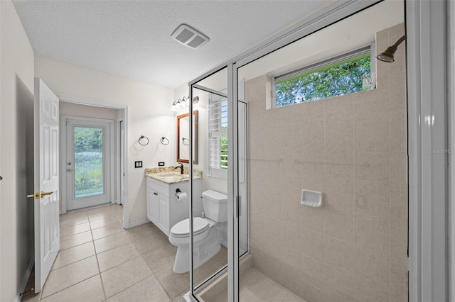 11815 Marblehead Dr, Tampa, FL 33626 - bathroom with tile patterned floors, toilet, vanity, a shower stall, and visible vents