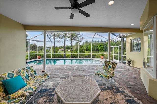 11815 Marblehead Dr, Tampa, FL 33626 - outdoor pool with a lanai, ceiling fan, and a patio