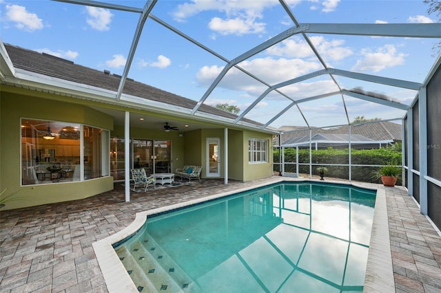 11815 Marblehead Dr, Tampa, FL 33626 - outdoor pool with a patio, a ceiling fan, and glass enclosure