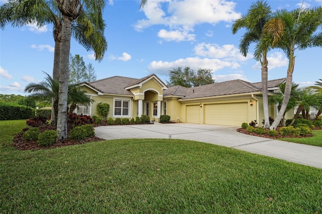 11815 Marblehead Dr, Tampa, FL 33626 - view of front of home with a tile roof, stucco siding, and an attached garage