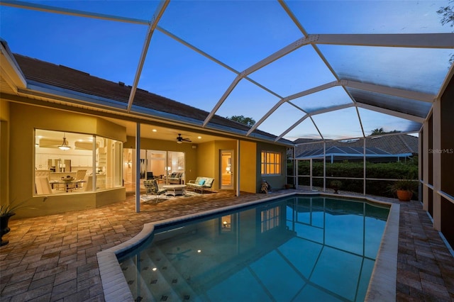 11815 Marblehead Dr, Tampa, FL 33626 - pool featuring an outdoor hangout area, glass enclosure, ceiling fan, and a patio area