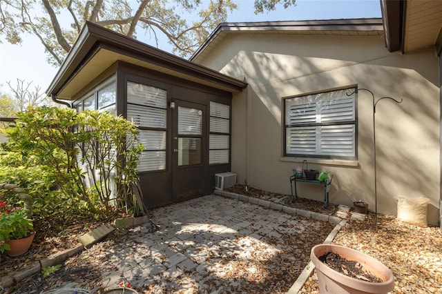 view of side of property featuring a patio area