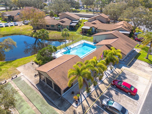 birds eye view of property featuring a residential view and a water view