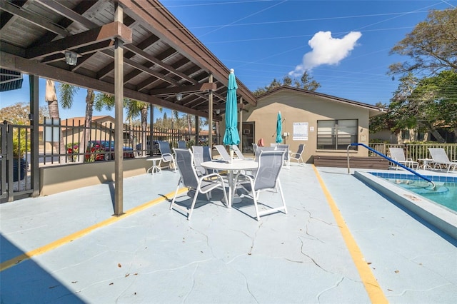 view of patio / terrace featuring fence and outdoor dining area