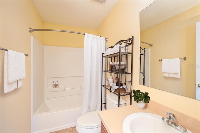 bathroom with shower / tub combo, vanity, and toilet