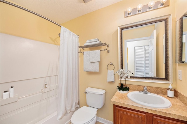 bathroom featuring toilet, shower / tub combo, a textured ceiling, and vanity